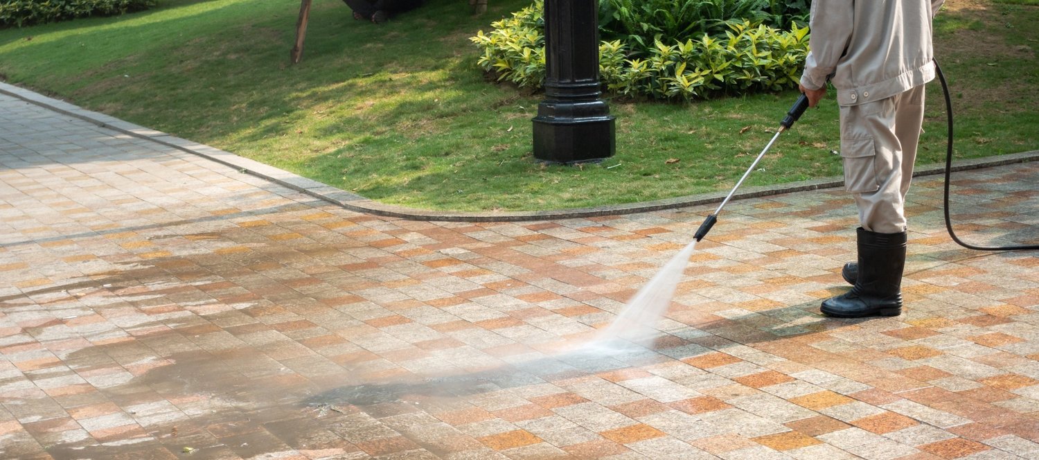 Pressure washing brick paver walkway